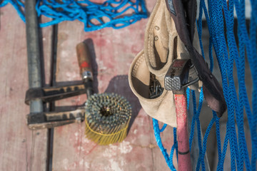 Close-up and focus on carpenter and roofer tool on the construction site