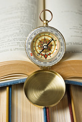 compass and old books