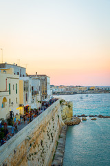 OTRANTO, ITALY - AUGUST 23, 2017 - panoramic view from the old town at sunset during turistic season