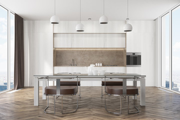 White kitchen with a table