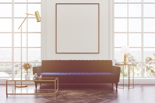 White living room, blue sofa, poster toned