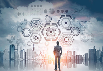 Businessman looking at HUD and infographics