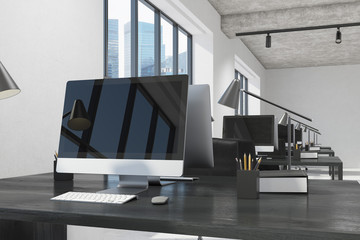 Fototapeta na wymiar Black computer screen in a white office, wood