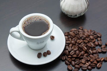 pile of coffee beans and a cup