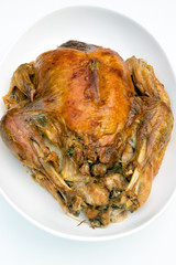 roast turkey golden brown on white platter