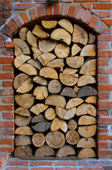 niche in the old brick wall in which the wood is placed into the fireplace