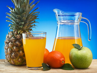 Fruit and juice on a wooden table