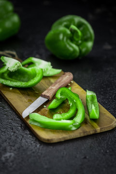 Fresh made Green paprika on a slate slab (close-up shot; selective focus)
