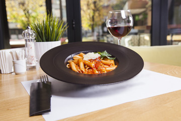 Beautiful macaroni with minced meat and vegetables on a plate. horizontal view from above