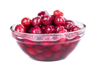 Cranberries (preserved) isolated on white background (selective focus; close-up shot)
