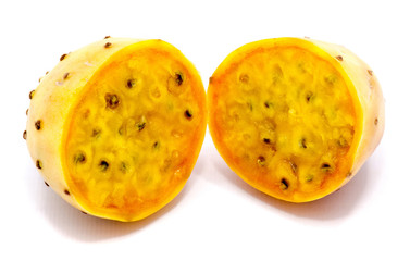 Sliced opuntia orange flesh with seeds, two halves, isolated on white background.