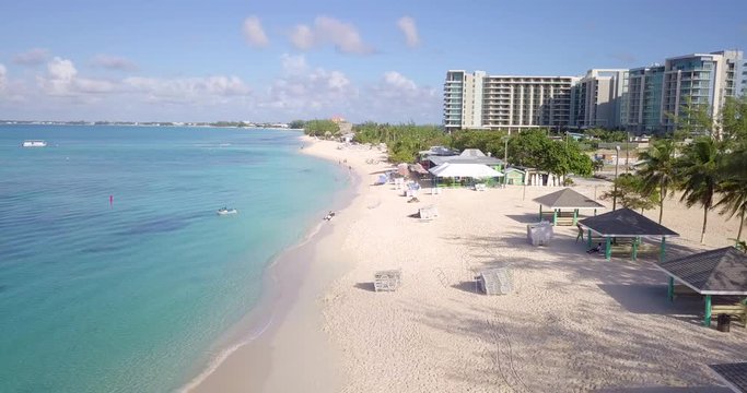aerial footage of seven mile beach in the tropical paradise of the cayman islands in the caribbean sea