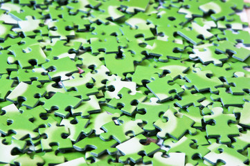 a pile of green puzzle
