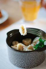 Meat dumpling on fork