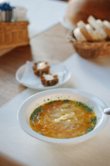Delicious vegetable soup at the table of restaurant or cafe.