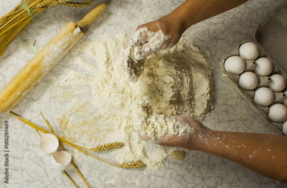 Wall mural dough with close-up. man is preparing bread dough