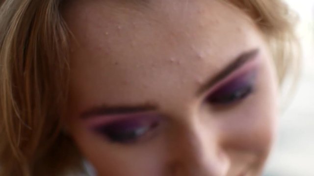 Beautiful portrait of a girl. Video in slow motion. A woman with a beautiful make-up