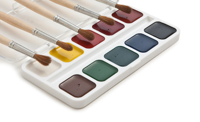 watercolor paints and  brushes