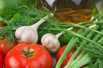 vegetables and a bottle of oil