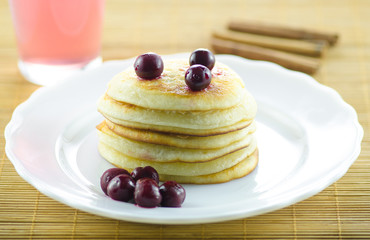 Pancakes with cherries on top
