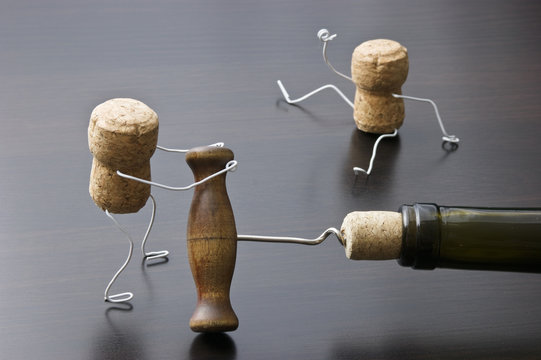 wine corks and bottle with corkscrew