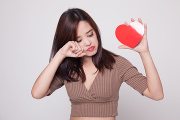 Asian woman sad and cry with red heart.