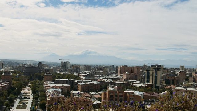 View of clouds above the Yerevan city with huge mountain ARARAT behind