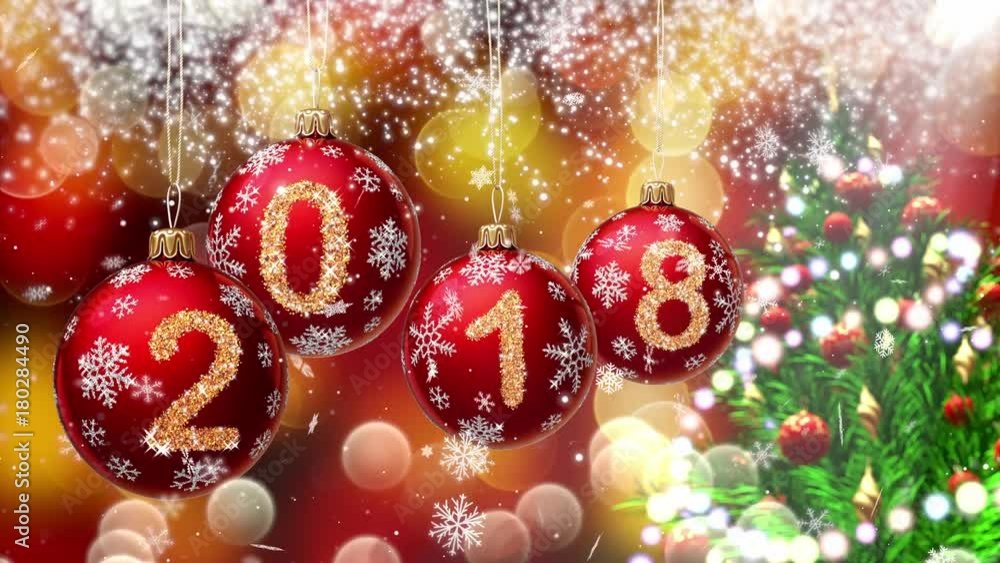 Sticker red balls with numbers 2018 hanging on the background of a bokeh and a rotating christmas tree. 3d r