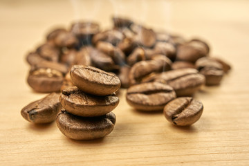 Freshly roasted coffee beans on a wooden table