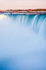 Long exposure of Niagara falls during the sunset - obrazy, fototapety, plakaty