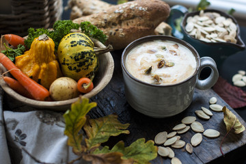 cream of pumpkin and potato soup in a mug