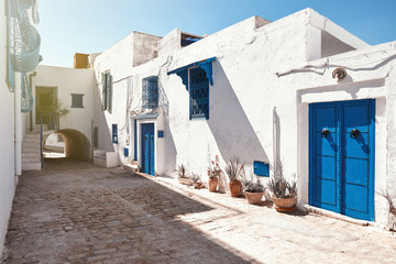 Obraz na płótnie Canvas Beautiful old street with blue windows.