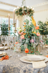 a dining table and comfortable armchairs in a modern house with a light dining room