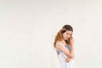 Portrait of asian bohemian girl on white wall,thailand people,hippie girl