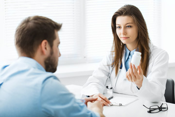 Fototapeta premium Doctor writes out the pills to the patient