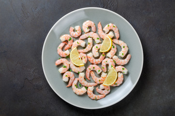 Roasted peeled prawns in a garlic and ginger sauce with herbs an