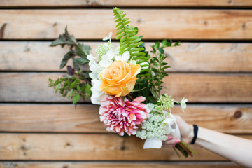 Floral Wedding Bouquet on Wooden Tablet background