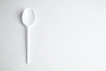 A white spoon on a white background.