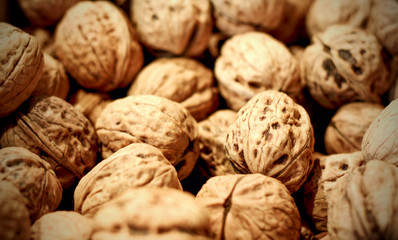 Brown raw walnuts textured bachground