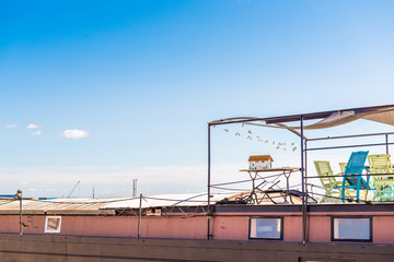 View of the roof of a building against a blue sky, Sete, France. Copy space for text