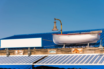 View of the facade of a seaside cafe, Leucate, France. Copy space for text.