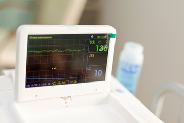 Cardiotocograph device  in a hospital  to examine  fetus heartbeat and make cardiogram while...