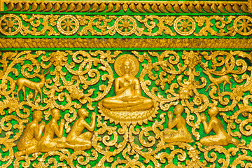 The bas-relief on the wall of the temple in Louangphabang, Laos. Close-up.