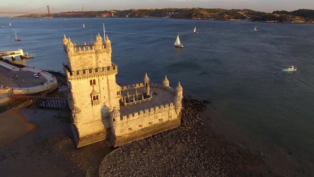 Lisbon, Portugal, aerial view of Belem Tower (Torre de Belem) by the Tagus river at sunset.