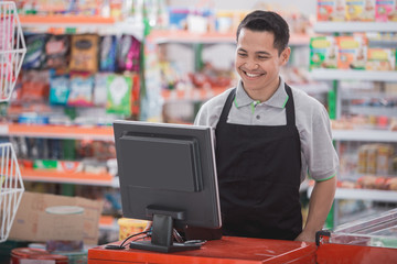 happy asian male shopkeeper