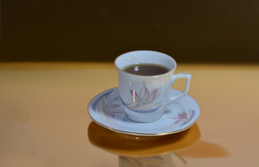 tea cup on gold background