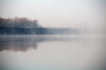 Fototapeta premium Morning on the river early morning reeds mist fog and water surface on the river