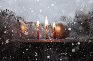 Burning candles, snow/ artwork in retro style