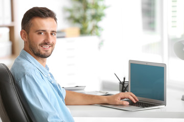 Male programmer working in office