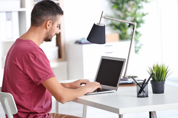 Male programmer working in office